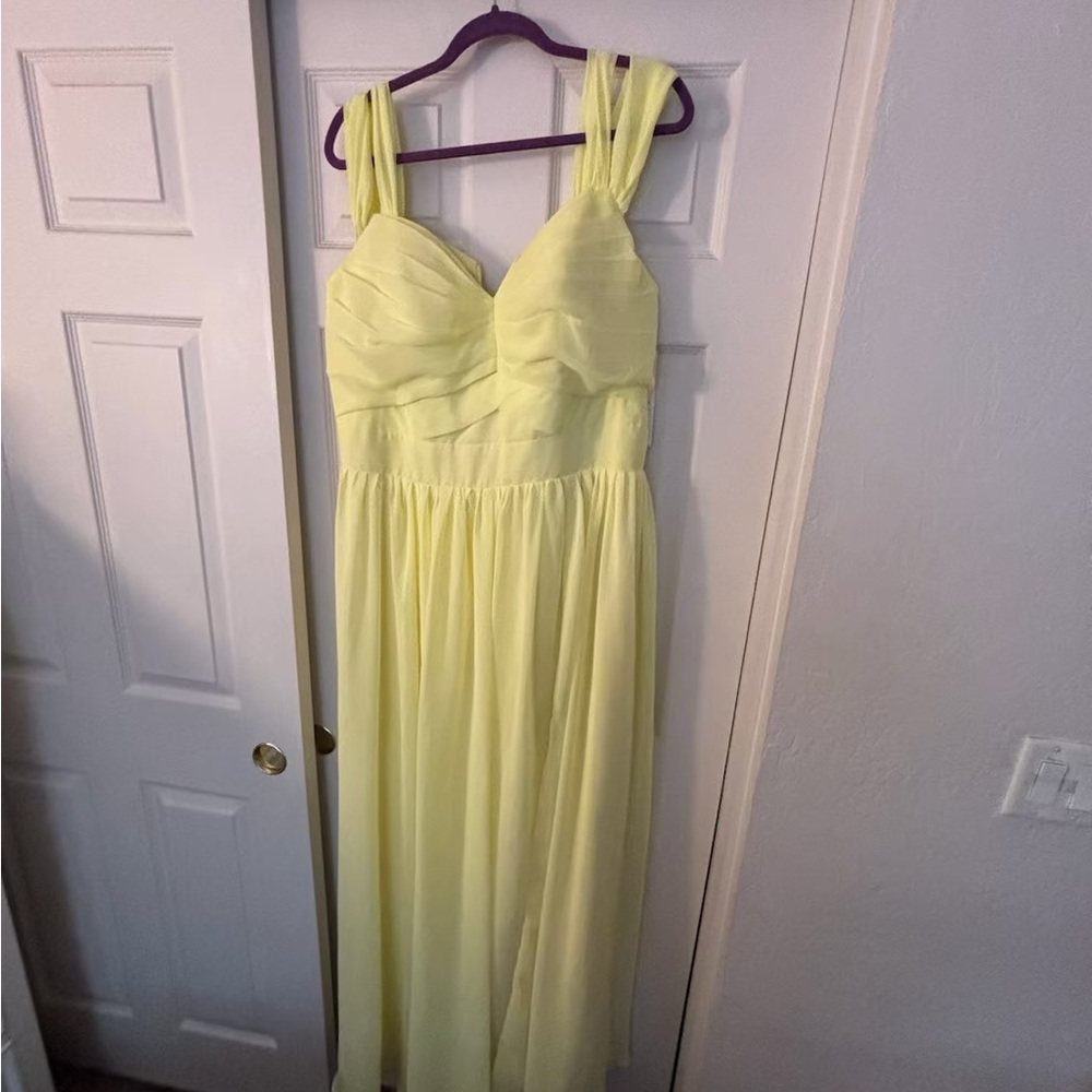 Yellow size 18 gown with lace up back.